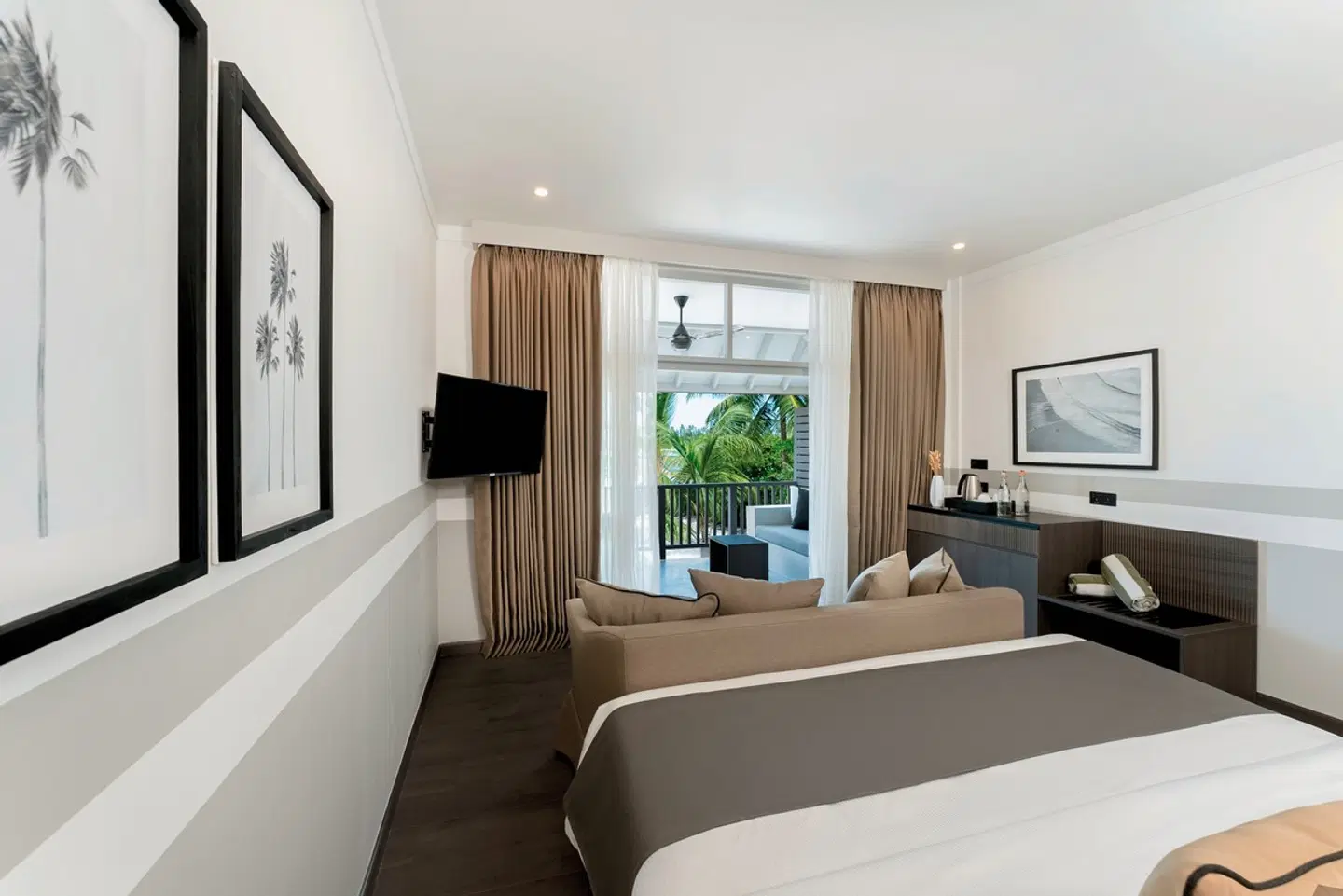 - The taupe, black, and grey palette lends tranquility to the interiors. The room, although on the cozier size, is cleverly designed and thoughtfully set as a non-smoking space. Terrace or balcony, daybed, couch… It’s all there. Yet you don’t feel cramped. The gorgeous black and white photography on the walls adds to the serene vibe. The pavilions' rooms can be interconnected with rooms with Twin or King-size beds. The Maldives' longest swimming pool at 210 meters with its sunken bar is located right outside the Beach Pavilion room category.
