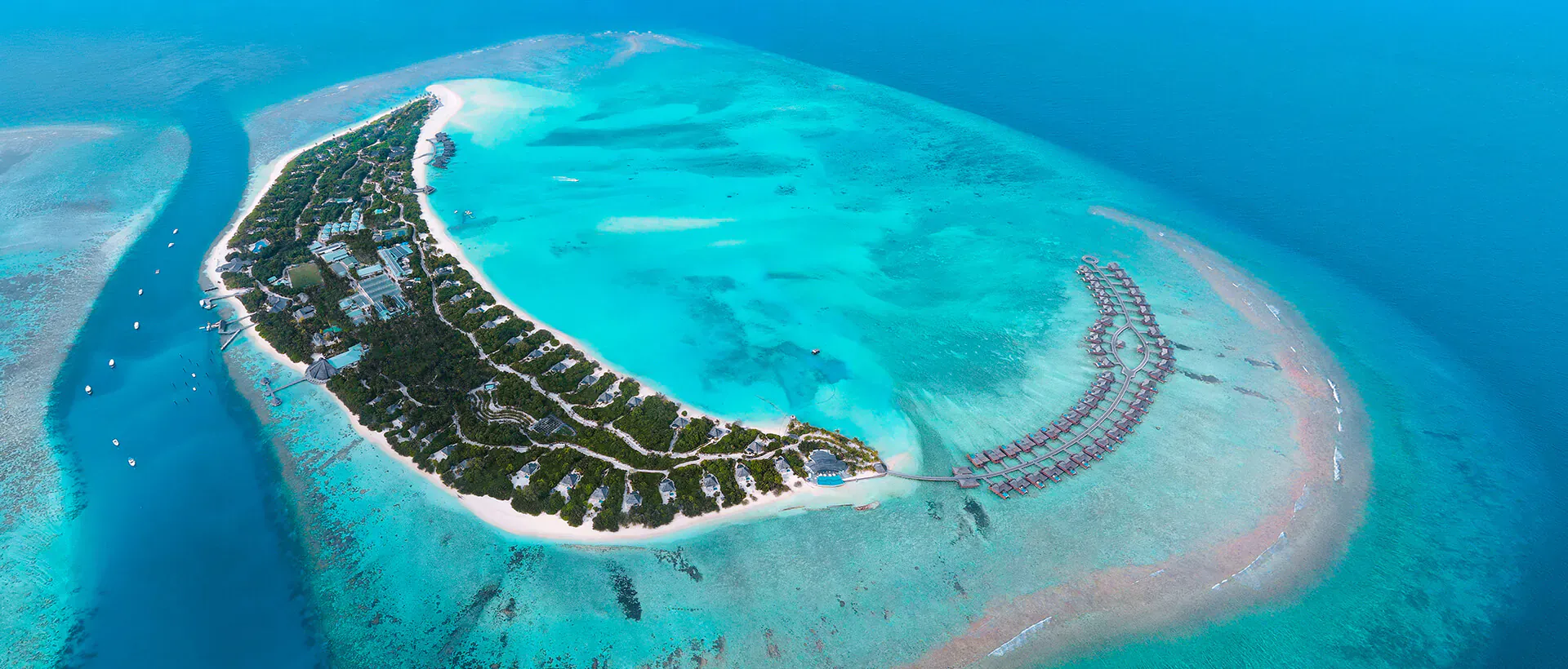 Hideaway Beach Resort & Spa is an exclusive five-star luxury resort located in the pristine Haa Alifu Atoll, Maldives, offering an extraordinary island escape surrounded by crystal-clear turquoise waters, powder-soft white beaches, and lush tropical landscapes. Renowned for its privacy, elegance, and world-class hospitality, the resort is the perfect destination for luxury travelers, honeymooners, and families seeking a truly unforgettable Maldivian experience.
The resort features spacious beachfront villas, overwater villas, and luxurious private residences, many with private pools and direct access to the beach or lagoon. Designed with a sophisticated blend of modern luxury and authentic island charm, each accommodation offers breathtaking ocean views and complete tranquility.
Hideaway Beach Resort & Spa is celebrated for its exceptional dining experiences, premium wellness spa, exciting water sports, and one of the largest natural house reefs in the Maldives, making it a paradise for snorkeling and diving enthusiasts. Guests can also enjoy personalized services, fine dining restaurants, sunset cruises, and a wide range of recreational activities. Combining elegance, privacy, and natural beauty, the resort delivers a truly luxurious tropical retreat in the heart of the Maldives
