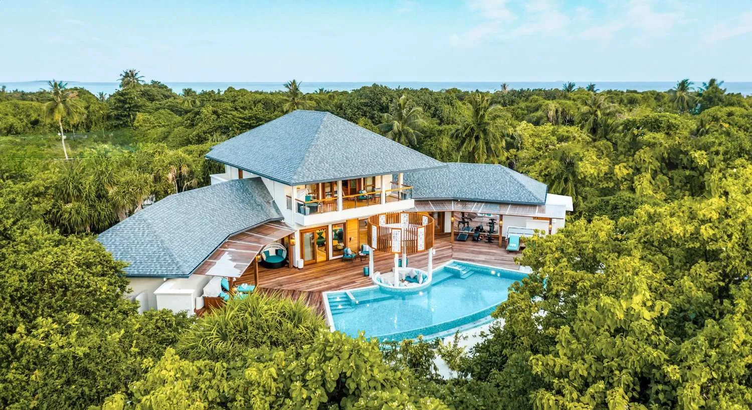 - 700 Sqm
- Craft lasting family memories at our three-bedroom Grand Beach Residence. This spacious Maldivian retreat in tropical gardens is the perfect backdrop for unforgettable moments. Enjoy sunny days and starry nights in this immaculate villa with a large pool, luxurious bathrooms, a deck with an outdoor gym, and a gazebo-an unparalleled blend of luxury and comfort.
