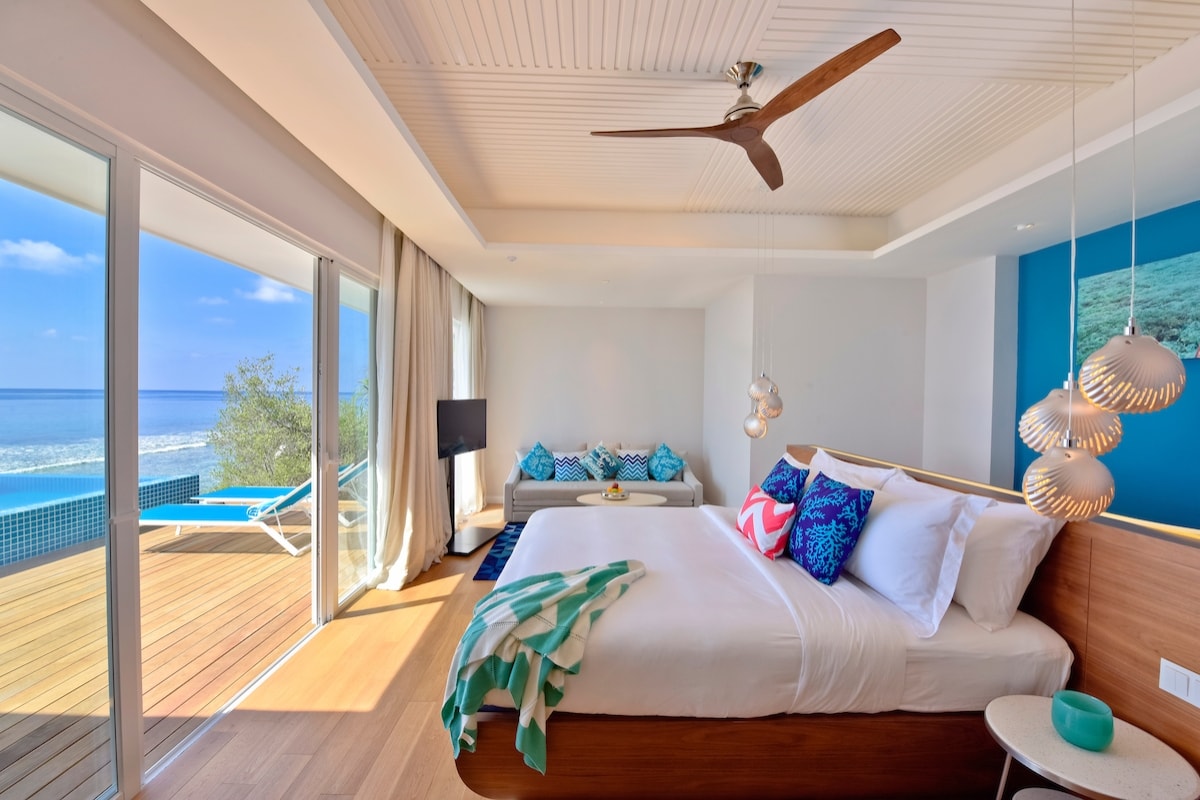 - 95 m2
- Suitable for couples and families
- 2 adults + 2 kids (Child policy disclaimer must be signed)
- Free Wifi
- In-room entertainment system with 40-inch LED TV
- Mini bar / Hair Dryer / Safe
- Coffee Machine
- Private deck with a pool big enough for a pool party!
- Freestanding bathtub with a sea view