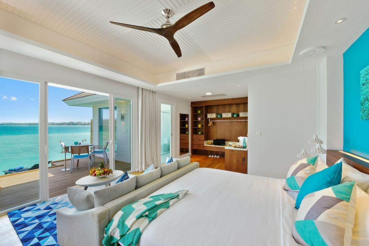 - 73 m2
- Suitable for couples and friends
- 2 adults + 2 kids (Child policy disclaimer must be signed
- Free Wifi
- In-room entertainment system with 40-inch LED TV
- Mini bar / Hair Dryer / Safe
- Coffee Machine
- Private deck with lagoon access
- Freestanding bathtub with a sea view