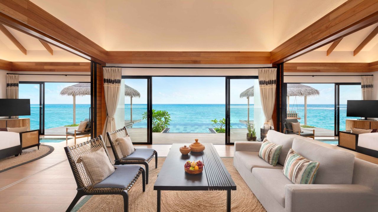- 338 sq. m. / 3638 sq. ft., separate living room, direct access to ocean
- This well-designed villa provides a sense of island living, with a comfortable living room and direct access to the ocean. The outdoor space features a private pool, deck and dining area, furnished with sun loungers, hammocks and a swing.
- The villa includes two king-size beds, complimentary WiFi, a private pool, coffee / tea facilities, a 55-inch HDTV, laptop safe, air conditioning, mini bar, and ceiling fan. Additional amenities include ensuite bathrooms, outdoor showers, bathrobes, and slippers. Sleeps 6 with two rollaway beds.