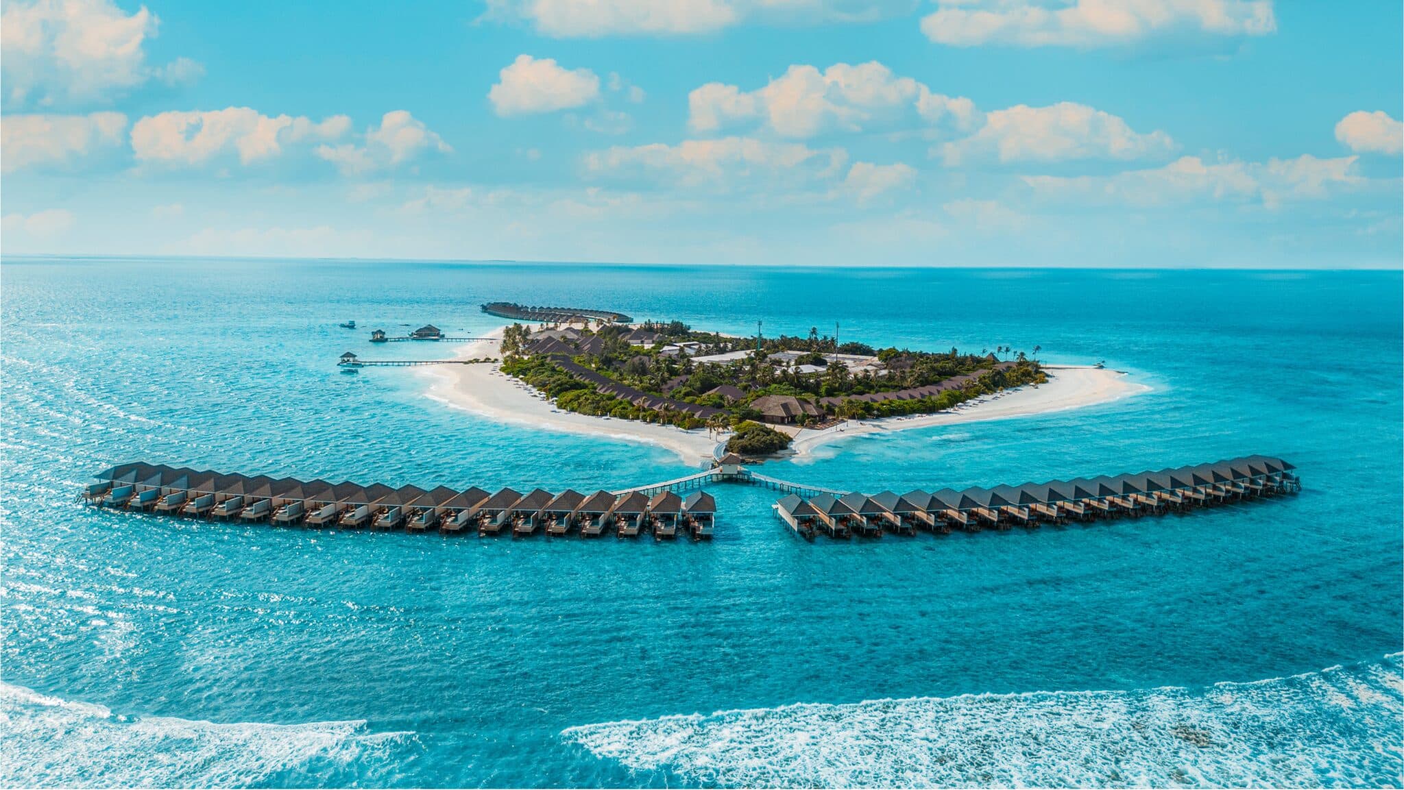 Brennia Kottefaru is a luxurious five-star resort located in the stunning Raa Atoll, Maldives, offering an unforgettable tropical escape surrounded by crystal-clear turquoise waters and pristine white sandy beaches. The resort is renowned for its breathtaking natural beauty, peaceful atmosphere, and exceptional Maldivian hospitality.
The resort features a wide selection of elegant beach villas and overwater villas, thoughtfully designed with a blend of modern comfort and authentic island charm. Guests can enjoy panoramic ocean views, private pools, and direct access to the lagoon, creating the perfect setting for relaxation and privacy.
Brennia Kottefaru also offers a variety of international dining experiences, exciting water sports, snorkeling and diving adventures, as well as a luxurious spa and wellness center. Whether for honeymooners, couples, families, or luxury travelers, the resort delivers a perfect combination of elegance, comfort, and unforgettable island experiences in the heart of the Maldives.