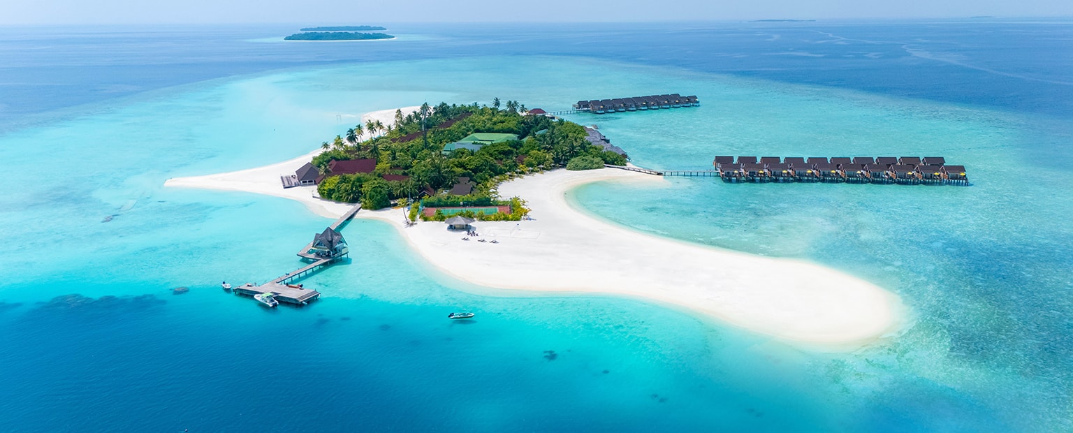 Dhigufaru Island Resort is a stunning luxury resort located in the UNESCO Biosphere Reserve of Baa Atoll, Maldives, offering a perfect combination of tropical beauty, elegance, and tranquility. Surrounded by crystal-clear turquoise waters, white sandy beaches, and lush natural vegetation, the resort provides an unforgettable island escape for travelers seeking relaxation and adventure.
The resort features beautifully designed beach villas and overwater villas that blend contemporary comfort with authentic Maldivian charm. Each villa offers spacious interiors, breathtaking ocean views, and direct access to the beach or lagoon, creating a peaceful and private atmosphere for guests.
Dhigufaru Island Resort offers a wide range of exceptional experiences, including world-class snorkeling and diving, exciting water sports, relaxing spa treatments, and fine dining restaurants serving international cuisines. Whether for honeymooners, couples, or families, the resort delivers warm hospitality, luxury services, and unforgettable memories in one of the Maldives’ most beautiful destinations