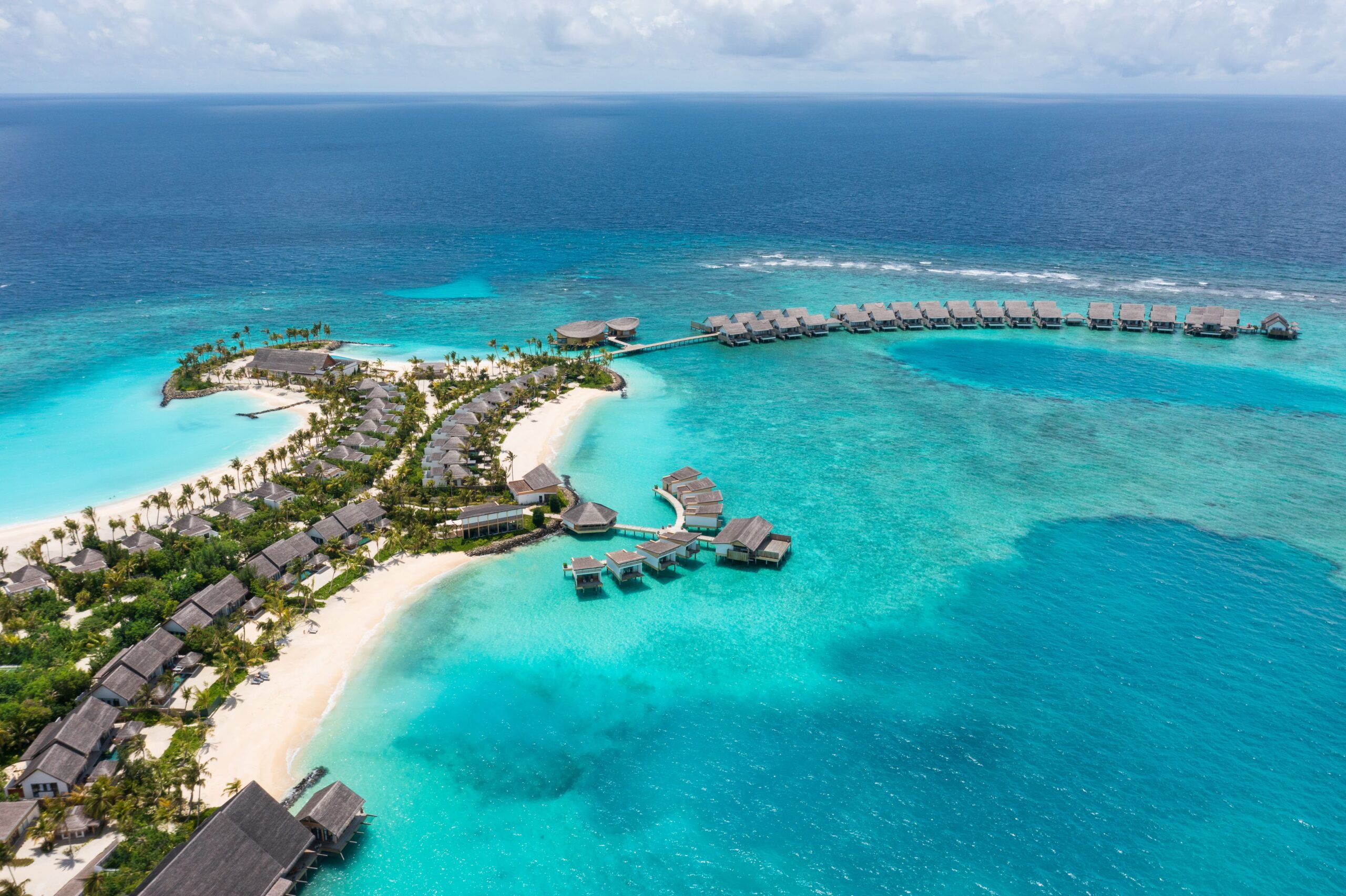 Hilton Maldives Amingiri Resort & Spa is a luxury island retreat located in the beautiful North Malé Atoll, offering a perfect balance between modern luxury, family-friendly experiences, and authentic Maldivian island living. Surrounded by crystal-clear lagoons, white sandy beaches, and lush tropical greenery, the resort combines Hilton’s world-class hospitality with a relaxed and vibrant island atmosphere