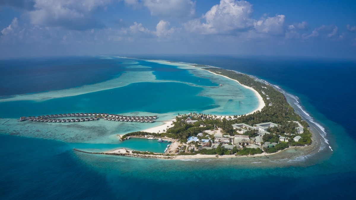Kandima Maldives is a vibrant lifestyle resort located in the stunning Dhaalu Atoll, offering a perfect blend of luxury, relaxation, and entertainment in the heart of the Maldives. Stretching over a lush tropical island surrounded by crystal-clear turquoise waters and white sandy beaches, the resort features stylish beach villas and overwater villas designed with modern comfort and breathtaking ocean views.
The resort is ideal for couples, families, and groups seeking a unique Maldivian escape, with more than 10 restaurants and bars serving international cuisines and refreshing drinks. Guests can enjoy a wide range of activities including diving, snorkeling, water sports, wellness experiences at the spa, fitness facilities, and one of the longest outdoor pools in the Maldives. With its lively atmosphere, contemporary design, and unforgettable island experiences, Kandima Maldives offers the perfect combination of adventure, comfort, and tropical luxury