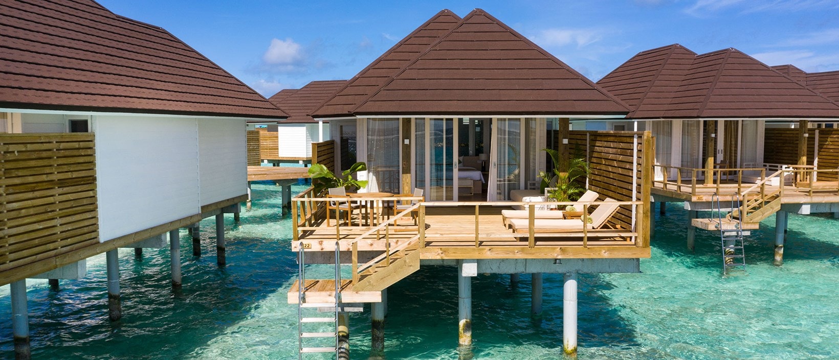 - Pale wood furnishings, indoor plants, and warm pastel tones give this villa its contemporary aesthetic. Spacious, each villa has a wooden deck with all the creature comforts needed to relax: sunbeds, a table and chairs, and a daybed. A stairway leads down to the turquoise warm waters. Our Grand Water Villa is designed for a modern family of four.