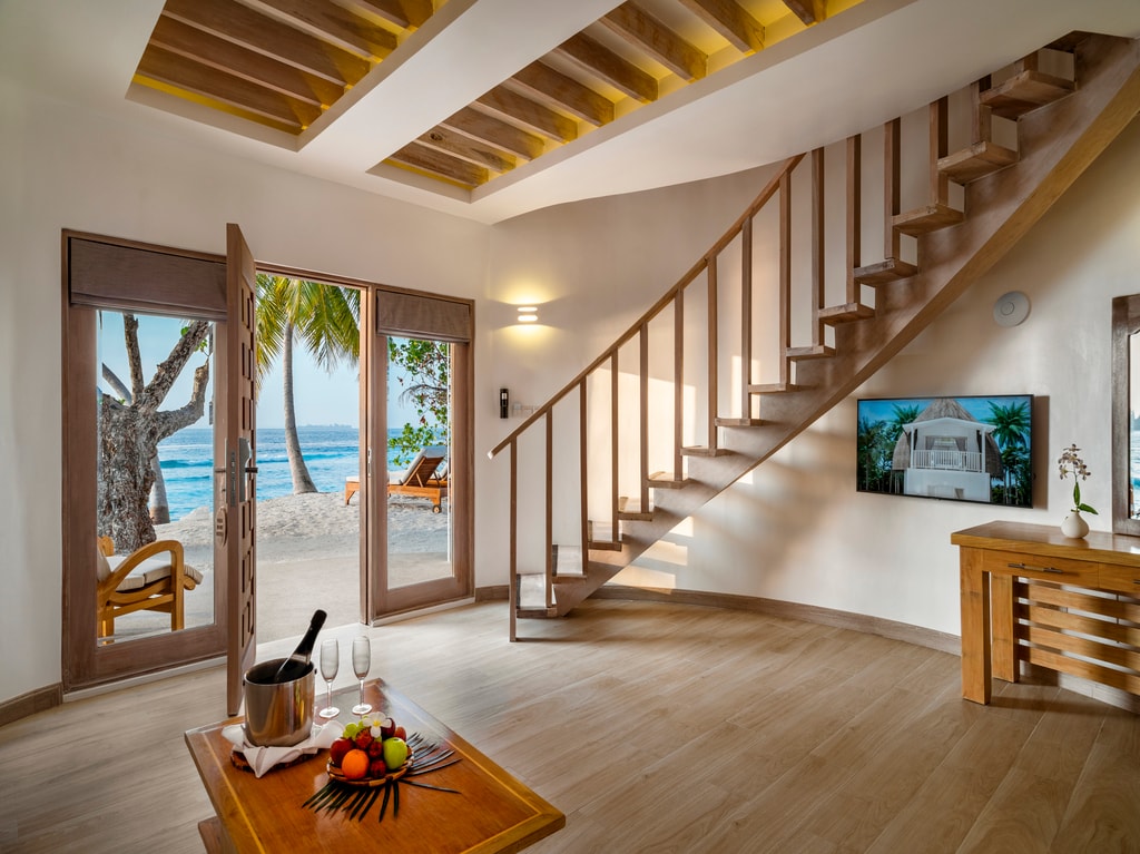 Our Premium Beach Villas set a mere stroll away from your exclusive strip of the beach, is the perfect tropical getaway for couples and small families. Designed with comfort and luxury in mind, the two-floor Villa features ample living space on the ground floor, a large sundeck, and a modern bathroom with an outdoor jetted tub. The upstairs bedroom, with its balcony and floor- to-ceiling windows, offer unparalleled beach vistas that you will cherish for a lifetime