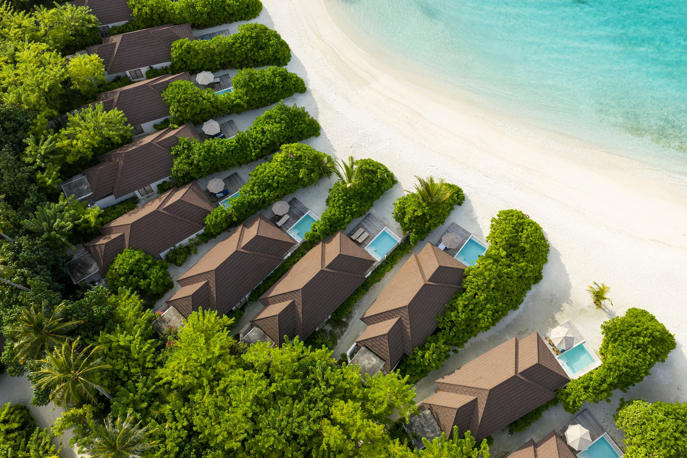 - It’s the dream Maldives beach villa. For starters the location is prime real estate, right on sandy shores, steps from the turquoise lagoon. The infinity pool is located beach-side as well, adding yet another shade of blue to the horizon. Plus, how convenient to be able to skip from pool to lagoon on repeat. The tropical white-washed bathroom is a delight.