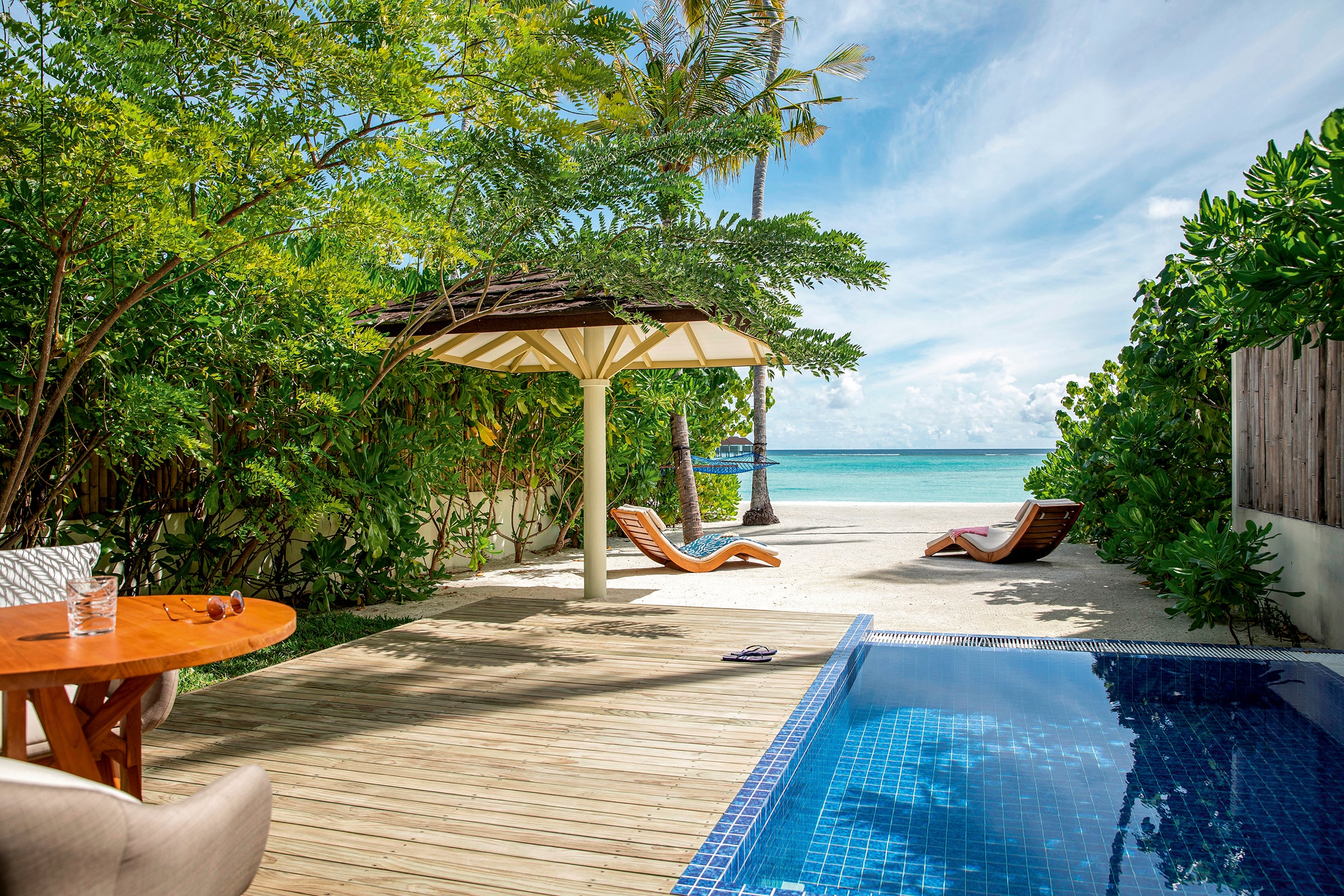- This villa was designed with couples in mind. There’s something about the private pool, the incredible location, and the breathtaking views that is oh-so-romantic. The design is contemporary with beach bungalow vibes. The pool is beach-side meaning you can spend your days alternating between pool and sea, sea and pool.